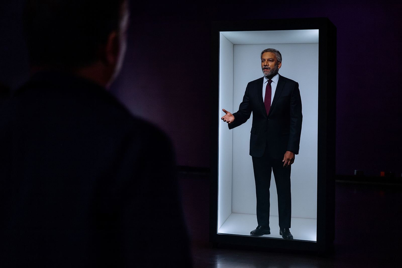 HoloChron Box with a life-size digital assistant and a visitor